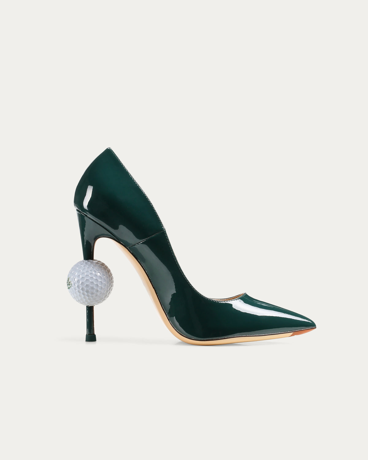 Green patent leather golf ball heel with sculptural golf-inspired design