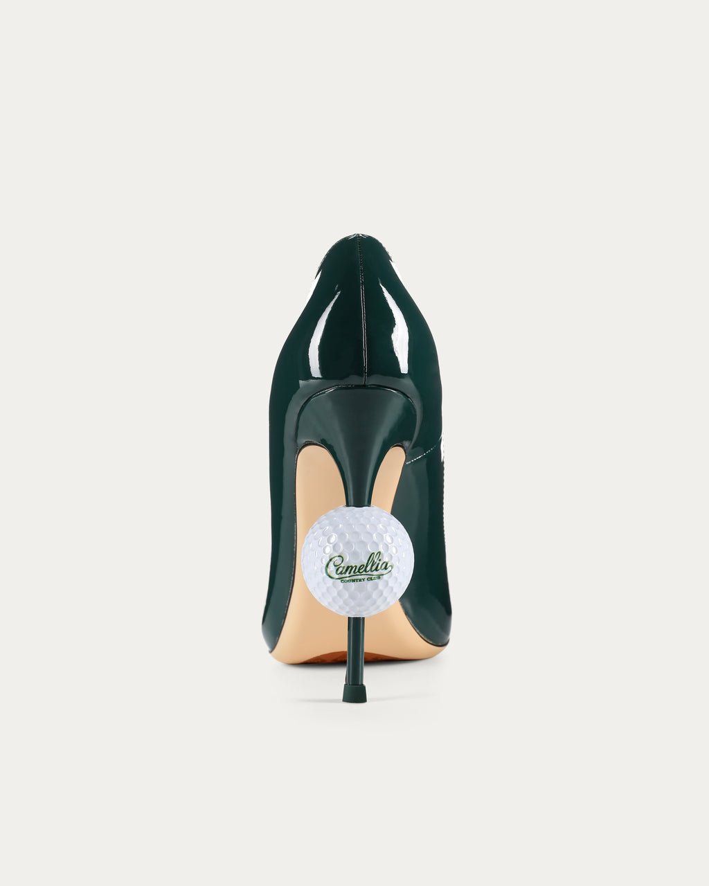 Close-up of the golf ball heel with Camellia Country Club logo detail